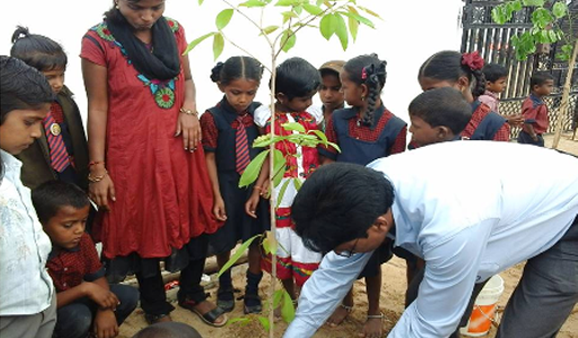 A tree plantation event was organised and books and pens were distributed to the children