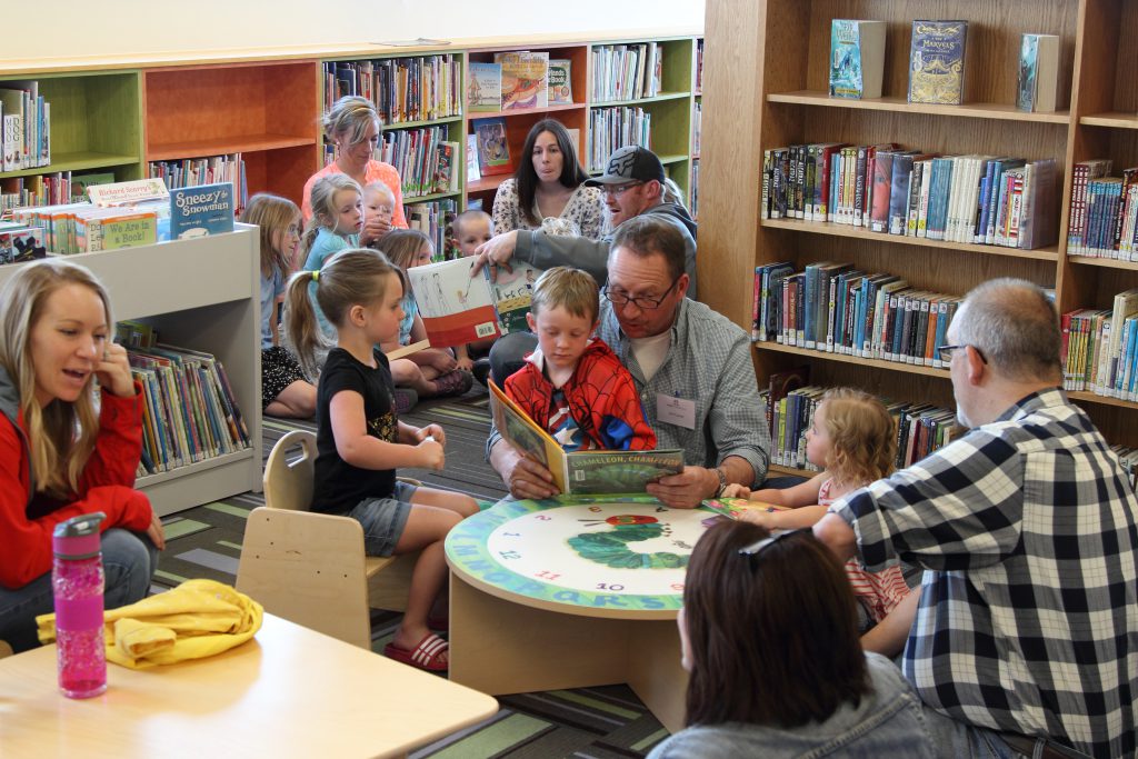 tata-chem-first-book-several-volunteers-reading