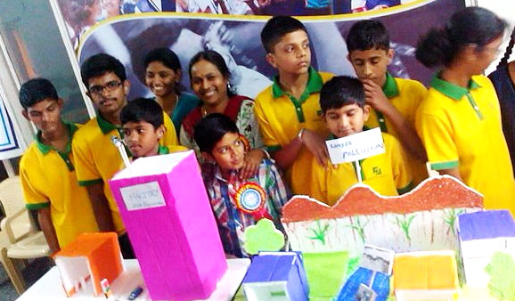 The students of AshrayAkruti who are hearing impaired share, with pride,  the paper models made by them
